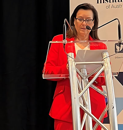 Kylie Dalton speaking at a lectern